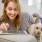 woman on tablet and pet
